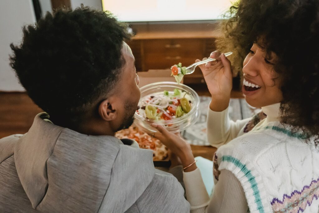 woman and man enjoying a healthy meal