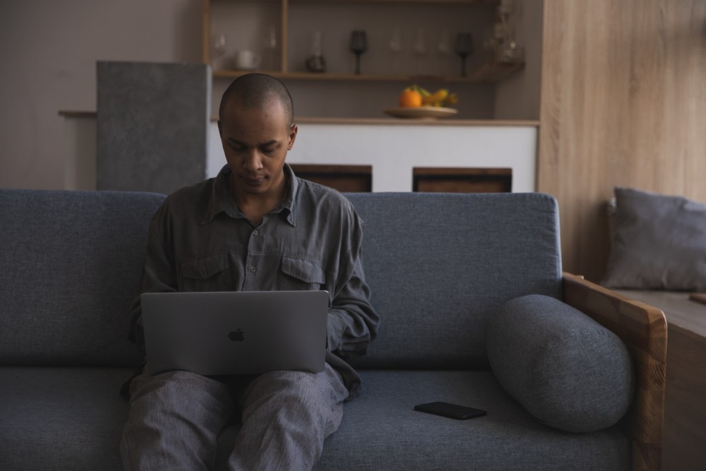 man sitting comfortable with his laptop
