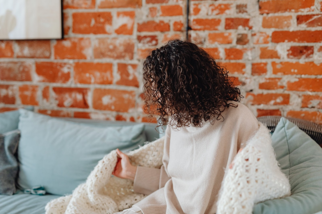 woman sitting on a comfortable couch