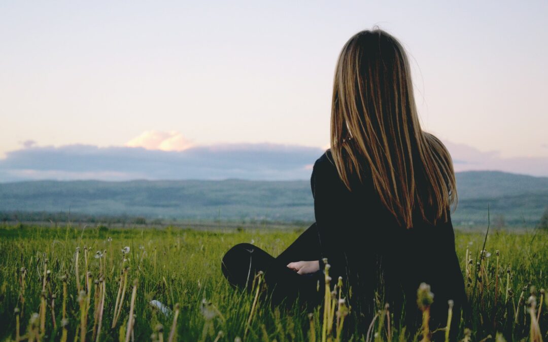 woman meditating staring at the horizon