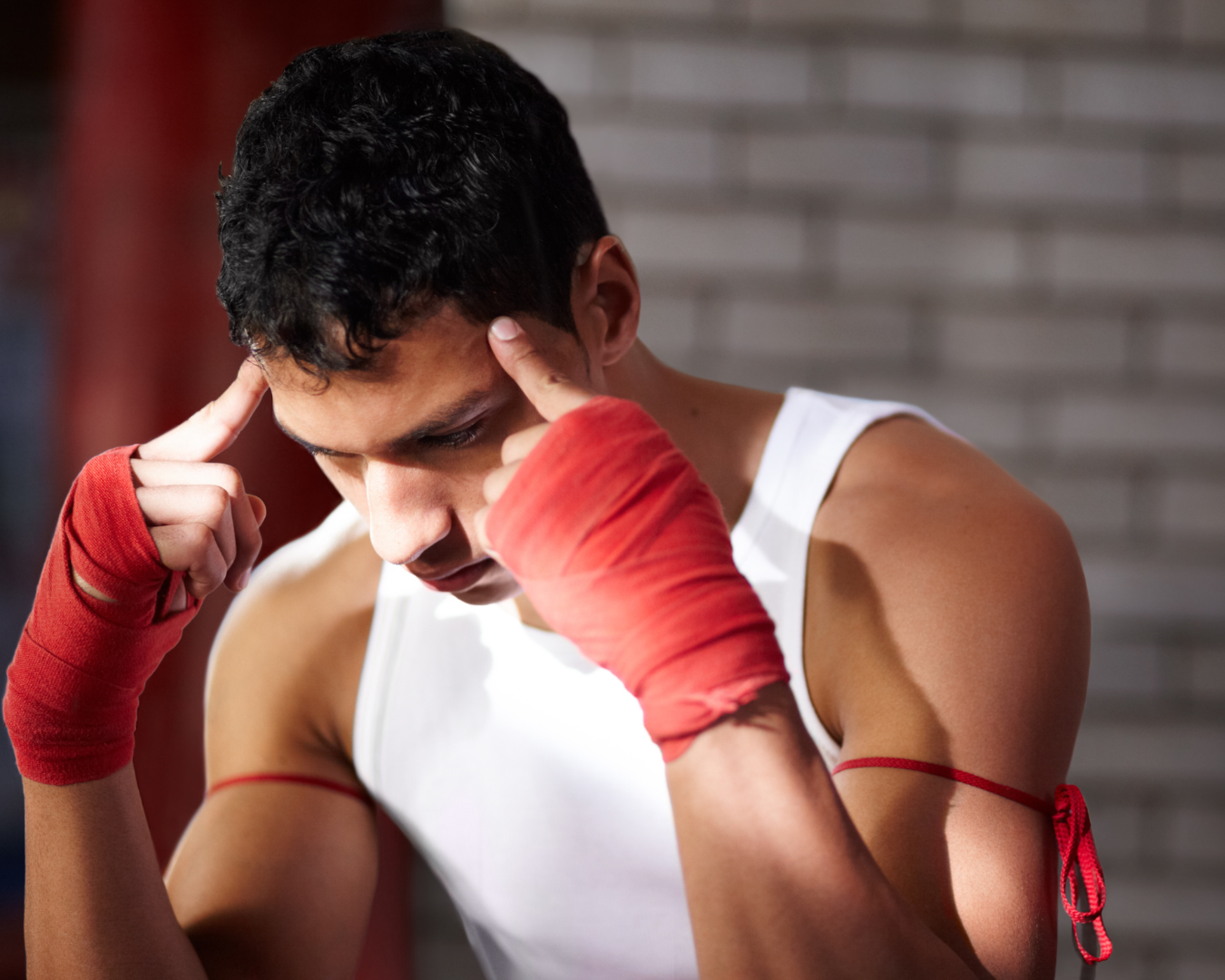 A young fighter mentally preparing before a fight