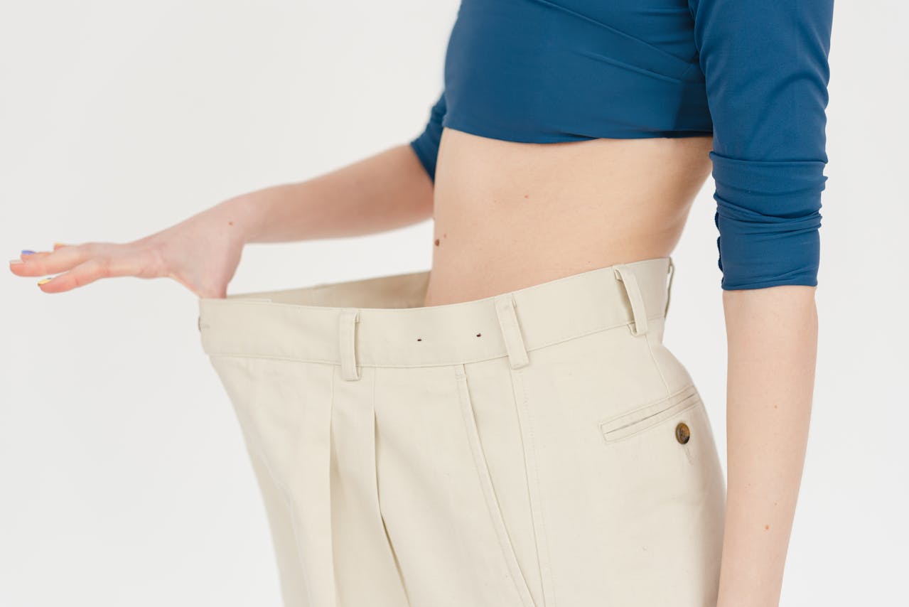 woman showing a gap in her pants waistline